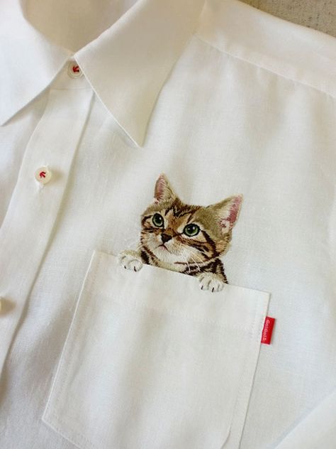 Embroidered Cat Shirts By Hiroko Kubota Go Viral And Sell Like Hot Cakes | Bored Panda Detail Couture, Pocket Cat, Pola Sulam, Cat Fashion, Japanese Embroidery, 자수 디자인, A Button, Embroidery Inspiration, Cat Shirts