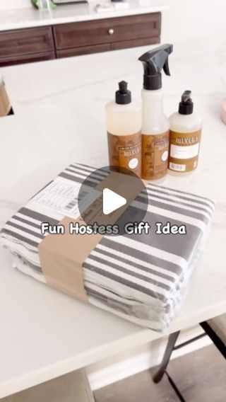 Debbie Sandler | Cleaning, Organizing, Home Tips on Instagram: "💛🤎🧡Hostess Gift Idea: The holiday season is right around the corner… or just every store I’ve been in today is simply early ie; homegoods, target and walmart 😉Regardless, I’m here for it!

So save this fun gift idea for your next invite, and you won’t have to worry about showing up empty handed.

TIP: Keep a package of new dish towels on hand just for this purpose. These are from my favorite brand on Amazon and they come in lots of great styles. You can use them in so many last minute DIY budget friendly gift ideas too. If you want to check them out, I’ll be happy to share and send u the info. 

Are you ready for the holiday season? 

#giftideas #hostessgift #diyideas #diygifts #homehacks #lifehacks #holidayvibes #fallvibe How To Gift Wrap Lotion Bottles, Dish Towel Wrapping Ideas, How To Wrap Lotion Bottles For Christmas, Dish Towel Gift Ideas, Soap And Towel Christmas Gift, Dish Towel And Soap Christmas Gift, Dish Soap Christmas Gift Tag, Hand Soap Gift, Budget Friendly Gift