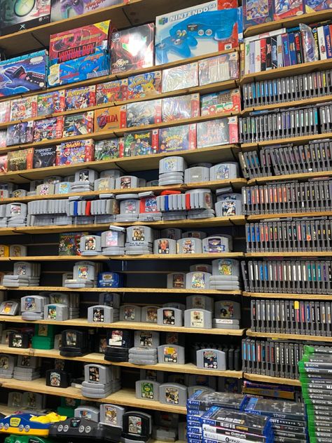 Game Store Aesthetic, Game Collection, 90s Video Games Aesthetic, Vintage Video Game Cabinet, Nintendo Collection Game Rooms, Retro Video Game Display, Board Game Store, Retro Gaming Console, Retro Games Room