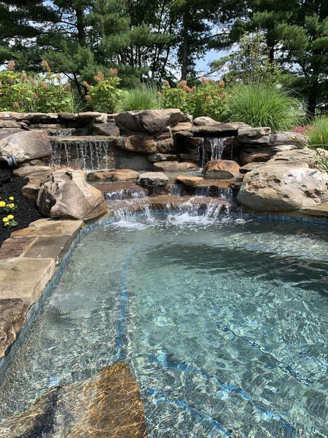 Natural Waterfall Pool, Natural Pool With Waterfall, Pool That Looks Like A Lake, Natural Swimming Pools Backyard, Pool That Looks Like A Pond, Freeform Pool With Waterfall, Waterfall Swimming Pool, Rock Pools Backyard, Rustic Pool Ideas