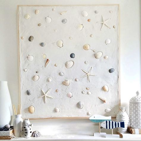 Create a summer mantel with a touch of coastal charm by plastering over a frame and embedding seashells before they dry. This simple yet stylish project adds a beachy vibe to your decor, perfect for capturing that summer feeling all year round whenever you look above your fireplace! Seashells On The Beach, Seashell Artwork, Summer Mantel, Beach Artwork, Sanded Grout, Plaster Of Paris, Coastal Charm, Chicken Wire, Summer Feeling