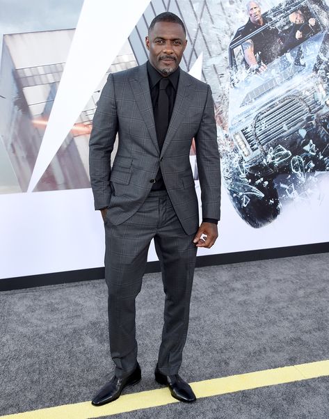 Black tie, black shirt, grey suit: sounds all sorts of mafia henchman. And that's why we - and by the same token, Idris Elba - like it very much. Helps that Tom Ford's responsible, too. Grey Suit Black Shirt, Black Shirt Outfit Men, Black And Grey Suit, Black Shirt Outfits, Grey Suit Men, Dark Gray Suit, Charcoal Gray Suit, Suit Combinations, Charcoal Suit