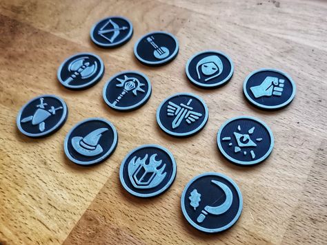 Introducing our 12 piece set of character class tokens for your D&D games! Our set includes all standard 5E character classes to help bring your D&D games to life. These tokens are available as digital downloads in STL format, so you can easily print them on your own 3D printer or send them to a professional printer. The files are also fully compatible with most virtual tabletop programs, allowing you to use them right away. Enhance your gameplay experience with this set of character tokens Character Classes, Dnd Tokens, Dnd Classes, Virtual Tabletop, Gaming Token, Magic Cards, Color Printer, Dnd Characters, Banner Ads