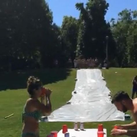 A group of Portland residents may have invented a new drinking game that combines a slip and slide with flip cup. Online Games For Kids, Beer Fest, Drinking Game, Tv Station, Slip And Slide, Drinking Games, One Team, Summer Drinks, A Group