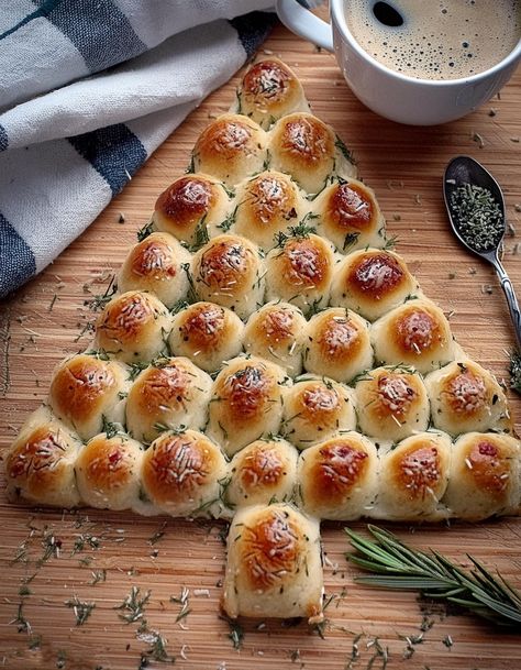 Savor the holiday cheer with Cheesy Christmas Tree Bread. A harmonious blend of garlic, butter, and melted cheese in a festive shape! Cheese Stick Christmas Tree, Christmas Tree Biscuit Appetizer, Christmas Tree Pepperoni Rolls, Pizza Dough Mozzarella Christmas Tree, Ham & Cheese Christmas Tree, Cheesy Pull Apart Bread Christmas Tree, Meat And Cheese Christmas Tree Cone, String Cheese Christmas Tree, Christmas Tree Garlic Cheese Bread