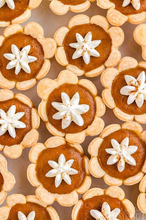 These Mini Pumpkin Pies capture all of the warm, comforting flavors of a traditional pumpkin pie but in a fun, bite-sized version. With a buttery, flaky crust and a rich, spiced pumpkin filling, theses adorable mini pumpkin pies are sure to be a hit at holiday parties, family gatherings, or a cozy dinner with friends! | MomOnTimeout.com Cupcake Pan Pies, Pies In Muffin Tin, Mini Pies In Muffin Tin, Vegan Pot Pie Recipe, Mini Pumpkin Pies Recipe, Mini Cherry Pies, Classic Pumpkin Pie, Mini Sweets, Vegan Pot Pies