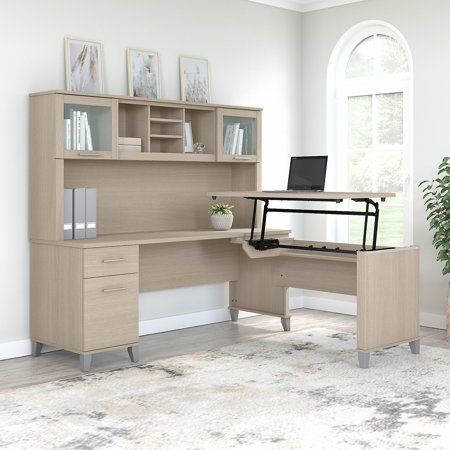 The Bush Furniture Somerset 72W 3 Position Sit to Stand L Shaped Desk with Hutch offers an ideal solution for those seeking a stylish and functional ergonomic workspace. As a quality alternative to desktop risers, the innovative 42W x 24D Sit to Stand Return offers all the health benefits of a standing desk with the versatility of more expensive electric height adjustable options. The built-in mechanical Lift-n-Lock system allows the desktop to lock into place at standing heights of 35, 38, and L Shaped Desk With Hutch, L Desk, Desk With Hutch, Frosted Glass Door, Desk Hutch, Sit To Stand, Office Set, Bush Furniture, L Shaped Desk