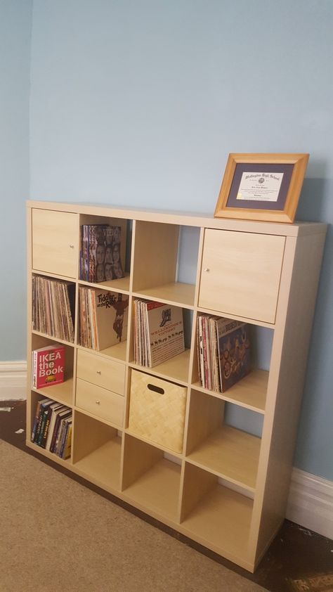 Kallax 4 X 4 unit in birch effect. I added two doors and one drawer unit. I also added a Bullig box. 4x4 Kallax Ideas, Kallax 30 X 30 Door, Wooden Kallax Ikea, Brown Kallax Ikea, Ikea Kallax Brown, Kallax Shelf Unit With 4 Inserts, Kallax Shelving Unit, Drawer Unit, Desk Shelves