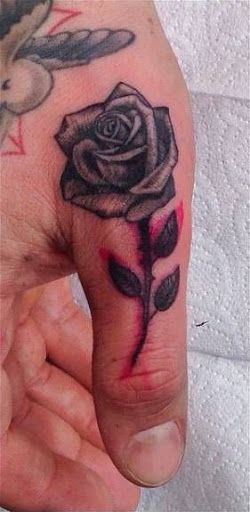 The 100 Best Finger Tattoos for Men | Improb Rose Thumb Tattoo Men, Rose Finger Tattoo, Men Finger Tattoos, Herren Hand Tattoos, Thumb Tattoos, Small Tattoos For Men, Rose Hand Tattoo, Rose Sleeve, Finger Tattoo For Women