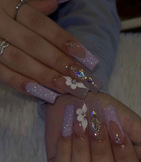 Lilac Baddie Nails, Latina Nail Designs Purple, Lavender Baddie Nails, Silver And Purple Acrylic Nails, Soft Makeup Look With Rhinestones, Purple Prom Nails Coffin, Short Acrylics With Rhinestones, Purple Latina Nails, Popular Acrylic Nails 2023