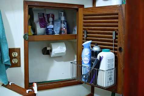 Over the cabinet door racks work well to add usable storage to louvered cabinet doors Rv Modifications, Boat Organization, Cheap Rv, Liveaboard Sailboat, Hanging Wine Glass Rack, Boat Interior Design, Sailboat Interior, Sailboat Living, Living On A Boat