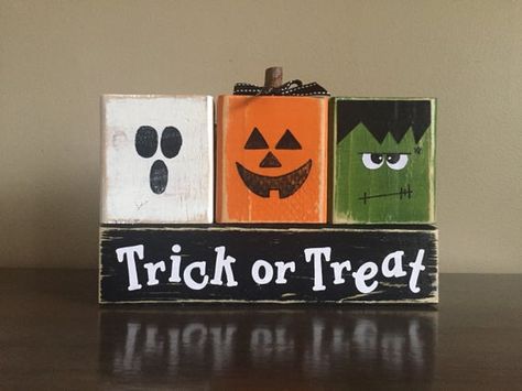 Wood Trick or Treat blocks. Seasonal home decor for fall and halloween decorating. They are the perfect size for a window sill, bookshelf, mantel, etc. Each block is painted black, orange, white, or green. Lettering is white or black scrapbook paper and sealed with a semigloss topcoat. Total 4x4 Crafts, Black Scrapbook Paper, Wood Halloween Decorations, Black Scrapbook, Pallet Halloween, Trick Or Treat Sign, Wood Halloween, Halloween Blocks, Fall Wood Crafts