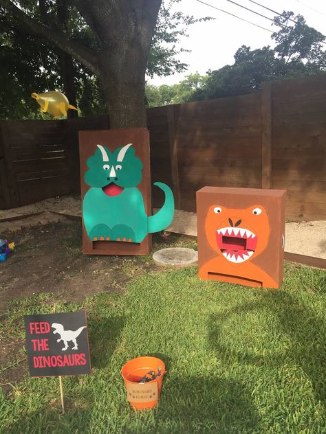 Dino Ring Toss Game, Kids Party Games Dinosaur, Diy Dinosaur Games Party Ideas, Dino Theme Games, Dinosaur First Birthday Party Decorations, Triceratops Toss Game, Dinosaurs Theme Party, Outdoor Dinosaur Party, Dinosaur Activities For Birthday Party