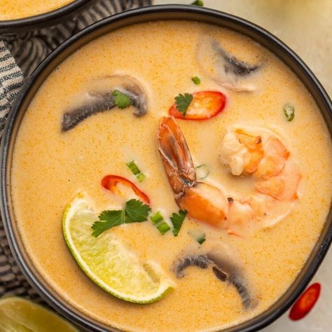 A seafood-based version of classic Tom Kha Gai. Tom Kha Goong replaces chicken with tender shrimp, keeping things light yet remarkably satisfying. This restaurant-quality soup is full of rich, tangy flavors from galangal to lemongrass, jalapeño to red chilies, coconut to lime. Incredibly easy to make, and easy to make Whole30, paleo, or vegan if needed. Tom Kha Soup Shrimp, Thai Coconut Shrimp Soup, Thai Coconut Shrimp, Tom Kha Gai Soup, Tom Kha Soup, Lemongrass Soup, Lemongrass Paste, Tom Kha Gai, Thai Shrimp