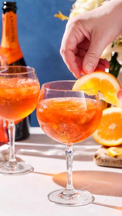 The Aperol Spritz is a delicious classic cocktail that is one of Italy’s most famous drinks! It’s so easy to make, and easy to drink too. It’s the perfect before-dinner cocktail (also known as an aperitif) and the flavor mix of Aperol with Prosecco is so tasty and refreshing. This cocktail is like an Italian sunset in a glass! Perfect for summer cocktail hour or anytime you want something light and bubbly. Italian Sunset, Famous Drinks, Classic Cocktail, Summer Cocktail, Adult Beverages, Three Ingredient, Delicious Cocktails, Aperol Spritz, Adult Drinks