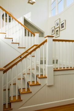 Simple white square balusters with natural wood railing Round Stairs Design, Basement Stairway Ideas, Basement Stairway, Basement Staircase, Basement Stairs Ideas, Round Stairs, Cape Style Homes, Open Stairs, Stair Makeover