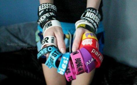 .... man how i want those! i only have 2. a Sleeping With Sirens one, and a "I Like Music" one. :D Emo Jewelry, Tumblr Quality, Band Bracelets, Band Outfits, Rocker Girl, Sleeping With Sirens, Love Band, Rubber Bracelets, Scene Fashion