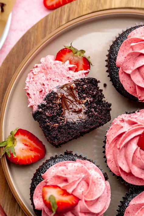 These chocolate strawberry cupcakes capture the essence of chocolate-covered strawberries! Moist chocolate cupcakes are filled with rich chocolate ganache and topped with strawberry buttercream frosting made from freeze-dried strawberries, delivering a bold, authentic strawberry flavor. Strawberry Chocolate Cupcakes, Strawberry Chocolate Ganache, Strawberry Ganache Recipe, Chocolate Dipped Strawberry Cupcakes, Chocolate And Strawberry Cupcakes, Chocolate Ganache Filled Cupcakes, Cupcake Filling Recipes, Strawberry Swiss Meringue Buttercream, Dark Chocolate Strawberry Cupcakes