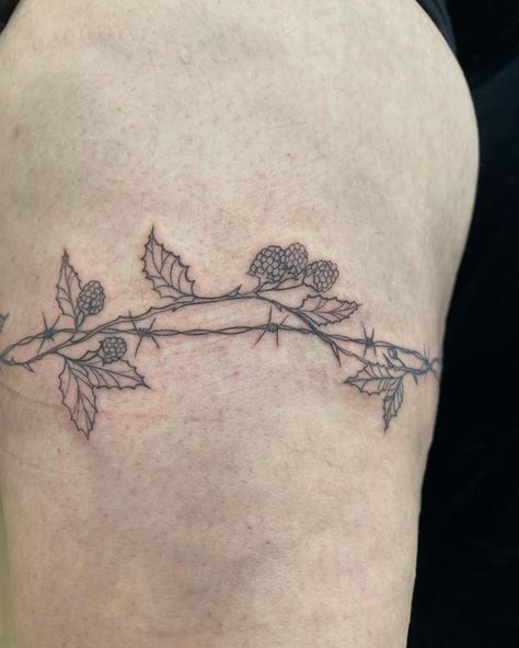 40 • the biggest wrap around i’ve done so far! a cool barbed wire and blackberry vine for Xanthe 🍇💜 so keen for your next appointment 🫶🏻 - DM for booking enquiries, currently booking august! apprentice rates - - #customtattoo #tattoo #tattooapprentice #tattooapprenticeship #tattooart #melbournetattoo #aussietattoo #aussieartist #wraparound #wraparoundtattoo #barbedwiretattoo Wrapped Barbed Wire Tattoo, Barbed Wire And Vine Tattoo, Barbwire Flower Tattoo, Blackberry Vine Tattoo, Wraparound Tattoo, Blackberry Vine, Blackberry Tattoo, Vines Tattoo, Barbed Wire Tattoo