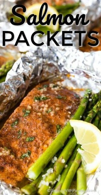 Salmon Foil Packets are so easy to prepare and super delicious! Lightly seasoned and doused in herb butter, the salmon is perfectly prepared while the asparagus is tender with just the right amount of crunch! #spendwithpennies #foilpackets #easyrecipe #salmonrecipe #cookingfish #easybake #lemonasparagus #simpletinfoil #healthybake Garlic Butter Salmon In Foil, Lemon Garlic Butter Salmon, Salmon Asparagus Foil, Salmon Packets, Salmon Foil Packets, Salmon Asparagus, Ginger Salmon, Salmon In Foil, Foil Dinners