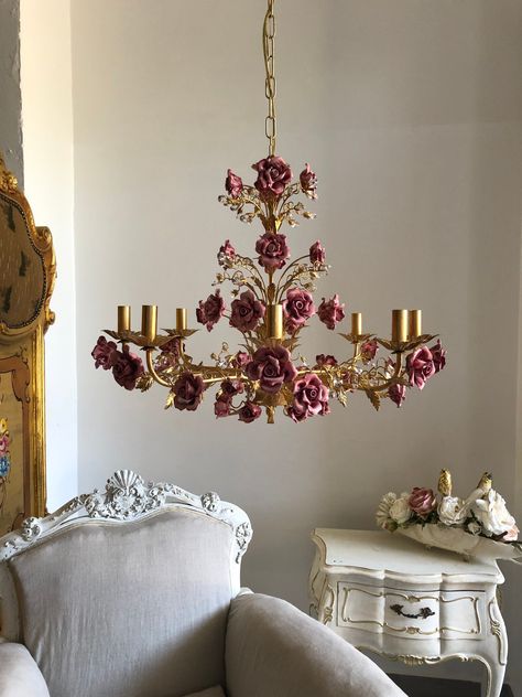 "Italian hand forged wrought iron 8 lights gold leaf chandelier, ceramic roses I want to introduce you to the collection of wrought iron chandeliers made in cooperation with the best artisans in Florence. This is a 8 lights chandelier in wrought iron with a luminous gold leaf finish. They can have pink, blue or ivory ceramic roses and match very nicely with the gold structure. Crystal blossoms had a touch of luminous elegance to the whole chandelier. Color of structure and roses can be customize Leaf Chandelier, Crystal Lights, Wrought Iron Chandeliers, Iron Chandeliers, Apartment Decor Inspiration, Dream Room Inspiration, Decoration Inspiration, Dream House Interior, Cute Room Decor