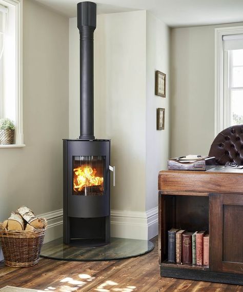 Wood burner ideas: 17 hot designs that will warm your heart and your home | Real Homes Corner Wood Stove Hearth Ideas, Wood Stove In Corner, Corner Wood Burning Stove Ideas, Corner Log Burner Ideas, Wood Burner Ideas, Free Standing Wood Burning Stove, Corner Log Burner, Corner Wood Stove, Wood Stove Hearth