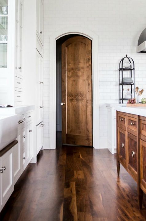 white kitchen with a stained hardwood floor and wood island and door - stunning! Classic Kitchen, Home Modern, French Farmhouse, Wood Doors Interior, Style At Home, Wood Flooring, Wood Cabinets, Home Fashion, 인테리어 디자인