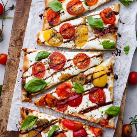 Caprese Flatbread - The Recipe Critic Caprese Flatbread, The Recipe Critic, Recipe Critic, Nutrition Labels, Balsamic Glaze, Perfect Appetizers, Grape Tomatoes, Fresh Mozzarella, Recipe Images