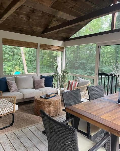 17 Screened In Porch Ideas for Year-Round Use - Farmhousehub Screened In Porch With Table And Couch, Screen Porches Designs, Screened In Porch With Dining Table, Patio Off Screened In Porch, Screened Outdoor Patio Ideas, Farmhouse Screened In Porch Ideas, Screened In Porch Layout, Screen Porch Furniture Layout, Screen Porch Inspiration