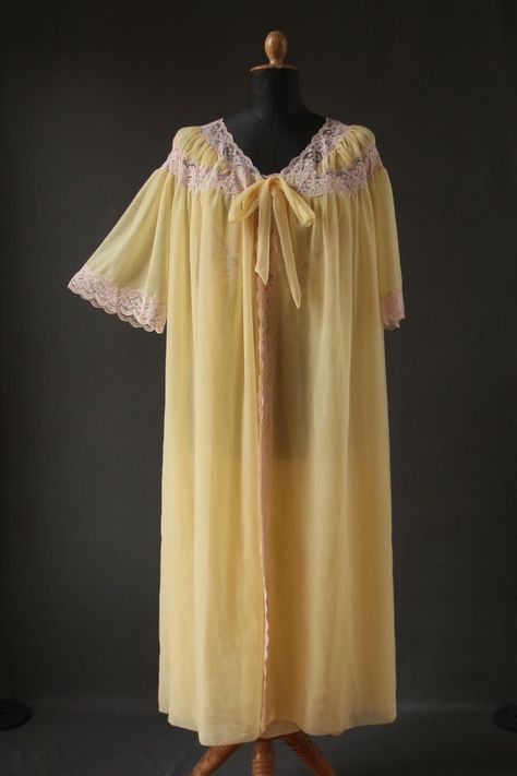 A mannequin wearing a 1960s yellow peignoir set consisting of dressing gown and nightdress in nylon tricot. 1960s Nightwear, Sleepy Core, Old Nightgown, Lacy Nightgown, 1960s Nightgown, Yellow Nightgown, Twst Oc, 1960s Lingerie, Vintage Peignoir