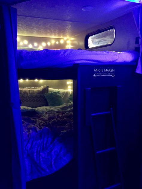 Decorated bunkhouse in RV travel trailer...blue led lights complete the look! Bunk Bed Led Lighting Ideas, Trailer Bedroom, Rv Bunkhouse, Led Lights Bunk Bed, Bunk Beds Decor Ideas, Room Ideas Led Lights, Bunk Bed Decorating Ideas, Rv Led Lights, Bunk Bed Decor