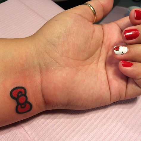 #hk bow to match her nails ❤️ #hellokittycon Hello Kitty Bow Tattoo, Bow Tie Tattoo, Kitty Tattoos, Kitty Tattoo, Hand Tattoos For Girls, Hello Kitty Tattoos, Hello Kitty Bow, Ribbon Tattoos, Bow Tattoo