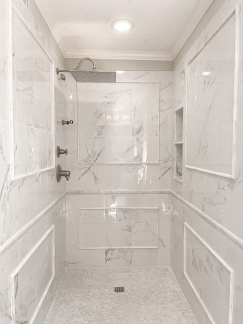 Marble tile Bathroom Marble Herringbone Floor, Marble Shower With Chair Rail, Shower With Chair Rail Tile, Marble Chair Rail Bathroom, Herringbone Master Bath, Classic Marble Bathroom, Herringbone Floor Bathroom, Herringbone Shower Floor, Marble Tile Bathroom Floor