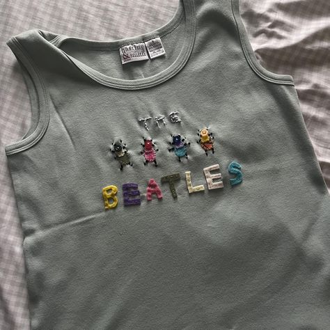 Cute green and multi-colored The Beatles tank

-... - Depop Diy Band Shirt Ideas, Patched Shirts Diy, Upcycling Thrifted Clothes, Sewn Clothes Inspiration, Diy Band Tee, Top Embroidery Designs, Diy Band Shirt, Patchwork Shirt Diy, Beatles Embroidery