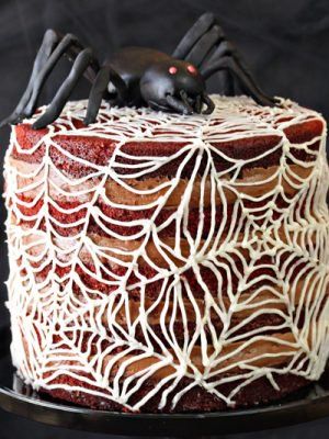 Spiderweb Naked Red Velvet Cake | From SugarHero.com Naked Red Velvet Cake, Spiderweb Cake, Butterbeer Cake, Spider Web Cake, Halloween Cake Recipes, Postres Halloween, Chocolate Cream Cheese Frosting, Halloween Party Treats, Red Velvet Cake Recipe