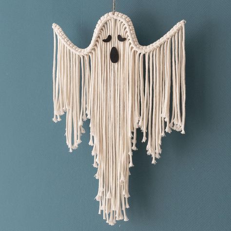 Bring a touch of eerie elegance to your space with our Halloween Macrame Ghost. This handcrafted wall hanging adds a whimsical yet spooky vibe to any room, perfect for your gothic office or Halloween festivities. Featuring intricate macrame details, it's an ideal decoration for those who love witchy goth style and dark academia. Elevate your spooky season decor with this charming ghostly addition to your home. This Macrame Ghost is handcrafted/ hand woven with Natural Friendly Cotton Cord.  DETAIL: - Dimension: + Size M: 11.8"W x 17.7"H ~ 30cmW x 45cmH + Size L: 15.7"W x 25.6"H ~ 40cmW x 65cmH - Please note your preferred number of ghost face at Personalization Area. If not, default - number 1 will be applied. NOTE: - The item is made to order, the listing photos are examples and the detai Gothic Office Decor, Gothic Macrame, Goth Tapestry, Macrame Ghost, Halloween Macrame, Spooky Wall Decor, Gothic Office, Boho Halloween, Witchy Goth