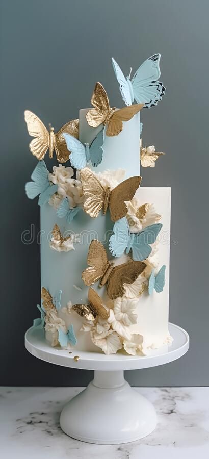 A blue and gold wedding cake with butterflies on the top. royalty free stock photo Blue Butterfly Cake, Blue And Gold Butterfly Cake, Blue Butterfly Quince Cake, Blue Butterfly Cake Ideas, Rose Gold Cake With Butterflies, Gold Butterfly Cake, Debut Cake Butterfly, Butterfly Quince, Butterfly Wedding Cake