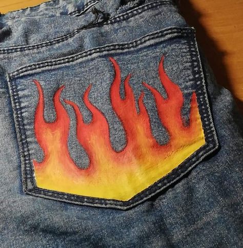 Fire Painted Jeans, Designs On Jeans Paint, Painted Clothes Aesthetic, Fire Painting On Jeans, Jeans Art Painting, Jeans Pocket Painting, Jeans Painting Ideas Aesthetic, Drawing On Jeans Ideas, Design On Jeans