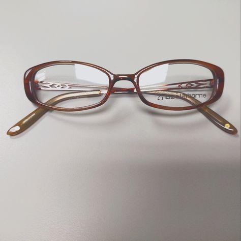 Vintage, Early Y2k Brown, Oval Plastic Eyeglass Frames With Demo Lenses. Metal, Detailed Cut Out Pattern On Temples With Brown, Plastic Temple Covers. Small Flaw In Demo Lens, But The Lenses Are Not Me At To Be Used For Wear. These Are Smaller Style Frame, Very Typical Of The Style Of The Early 2000s. New, Old Stock. Nostalgic Y2k Fashion. 2000s Genre. L227 Model Sk4 Color Brown Eye Width 50mm Eye Height 27mm Bridge 18mm Temple Length 135mm Glasses Thick Frames, Funky Eyeglasses For Women, Early 2000s Glasses, Oval Glasses Frames For Women, 90s Glasses Frames, Trendy Glasses Frames 2024, Browline Glasses Women, Rectangle Glasses Woman, Y2k Eyeglasses