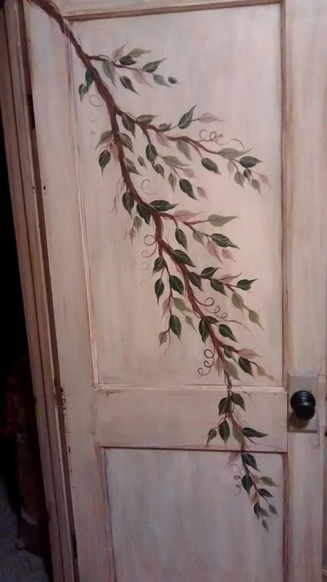 This is a Painted Door for a bedroom.  It was given an antique finish after painting.   A branch with multiple colors of leaves. Cottagecore Door Decor, Aesthetic Bedroom Door Ideas, Cool Bedroom Door Ideas, Drawing Door Ideas, Painting Closet Doors Ideas, Paint Bathroom Door Ideas, Floral Door Painting, Painting Ideas For Doors, Bedroom Door Ideas Aesthetic