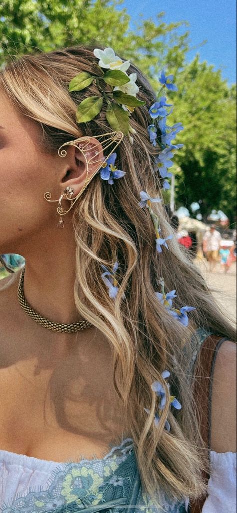 Blonde curly hair hairstyle wedding hairstyle braids flowers Festival Hair Flowers, Earth Day Hairstyles, Renfest Hairstyles, Whimsical Braided Hairstyles, Fairy Garden Hairstyle, Garden Fairy Hair, Flower In Curly Hair, Hairstyles With Ribbon Curly Hair, Prom Hairstyles Flowers