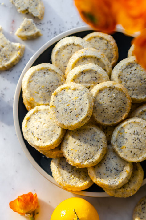 These simple and sweet Lemon Poppy Seed Shortbread Cookies start with a basic, buttery shortbread base. A light and fresh mix of lemon and poppy seeds gets mixed in to brighten the easy slice and bake cookies with sunny flavor. Chicken And Veggie Sheet Pan, Veggie Sheet Pan, Strawberry Pistachio, Poppy Seed Cookies, Shortbread Cookie Crust, Rose Strawberry, Almond Shortbread, Shortbread Cookies Easy, Lemon Shortbread Cookies