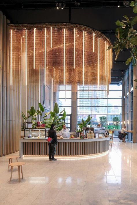 a man stands at the bar of the world port center rotterdam surrounded by green plants Circle Room Design, Event Room Design, Lobby Area Design, Circle Interior Design, Vertical Lighting, Circle Room, Waiting Room Design, Layered Curtains, Event Room