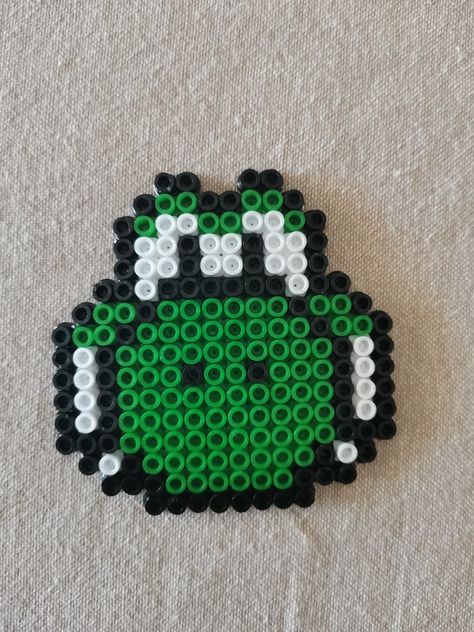 I tried making Yoshi from Super Mario with perler beads. Perler Bead Video Game Controllers, Mario Fuse Bead Patterns, Mario Hama Beads Pattern, Perler Beads Yoshi, Pearler Bead Mario, Mario Fuse Beads, Golf Perler Beads, Yoshi Perler Bead Patterns, Yoshi Craft