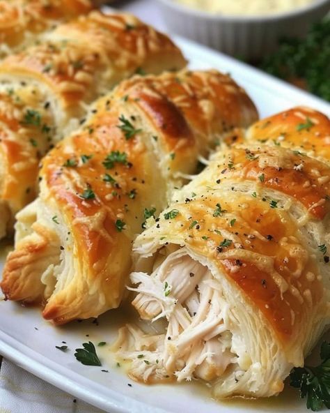 Chicken Bundles 😍 Ingredients:  3 cups shredded cooked chicken (I used a rotisserie chicken) 8 ounce block cream cheese, softened to room temperature 10.5 ounce can cream of chicken soup 2 tablespoons grated Parmesan cheese 1 teaspoon dried parsley flakes ½ teaspoon black pepper ½ teaspoon kosher salt ½ teaspoon garlic powder ½ teaspoon onion powder 2 cans crescent roll dough 2 tablespoons unsalted butter, melted  Directions:  Preheat the oven:  Preheat your oven to 375°F (190°C). Line a baking sheet with parchment paper or lightly grease it.  Prepare the filling:  In a large mixing bowl, combine the shredded cooked chicken, cream cheese, cream of chicken soup, grated Parmesan cheese, dried parsley flakes, black pepper, kosher salt, garlic powder, and onion powder. Mix until well combined Chicken Bundles Recipe Crescent Rolls, Chicken Bundles, Cooking Chicken To Shred, Crescent Roll Recipes, Crescent Roll, Roll Recipes, Chicken Meals, Chicken Dinners, Chicken Dishes Recipes