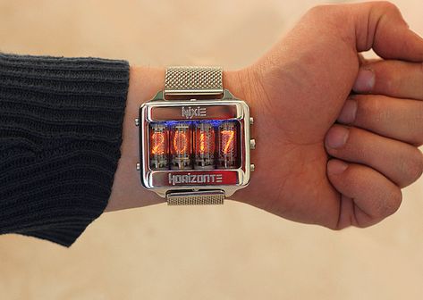 We've seen Nixie-tube-based clocks before, but Italy-based Igor Gudiy has taken them to another level. Under the shop name NixieHorizonte, Gudiy is selling Nixie-tube wristwatches of his own design on Etsy: The watch can display the time in either 12- or 24-hour format, as well as the date and even Nixie Tube Watch, Gamer Room Diy, Latest Technology Gadgets, Nixie Tube, Steampunk Clock, Watch Clock, White Clocks, Amazing Watches, Punk Vintage