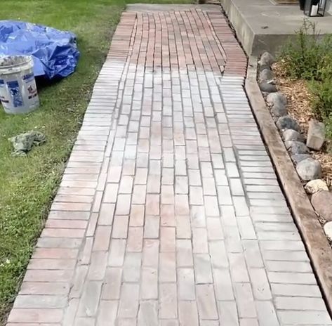 I wanted to add some curb appeal to our front steps, so I added some brick pavers over my existing concrete pathway...yes, that's right...OVER the existing sidewalk. Here is what our walkway looked like before...boring beat up concrete. First, I roughly laid out the brick pattern I would use. Then I mixed grout up in a bucket. Make sure to use exterior grade grout. Then I started to lay the grout with a thinly notched trowel. Then I put a small amount of grout on each brick and… Brick Pavers Over Concrete Sidewalk, Brick Concrete Walkway, Brick Paver Walkways To Front Door, Brick Paver Sidewalk, Front Yard Brick Walkway Ideas, Brick Sidewalk Ideas, Pavers Over Concrete Walkway, Brick Sidewalk Front Walkway, Brick Overlay On Concrete