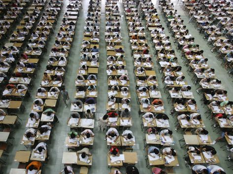 Once in the testing rooms, students take the exam, which is comprised of three main areas of testing: English, math, and Chinese. Below, students take an English exam in an exam hall at Dongguan University. College Entrance Exam, English Exam, Maths Exam, Exam Time, Entrance Exam, Foreign Policy, Business Insider, School College, High School Students