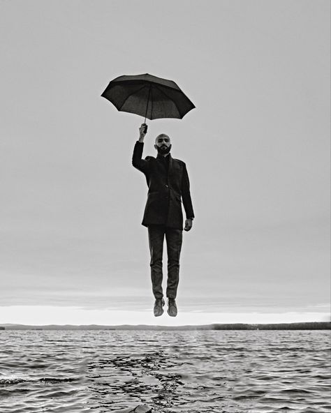 #fly #man #gentleman #umbrella #water #bnw #monochrome Man With Umbrella, Leaf Umbrella, Distortion Photography, Bulb Ideas, Men Posing, Umbrella Tattoo, Man On Fire, Umbrella Man, Lake Dock