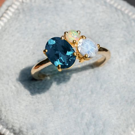 "Toi Et Moi Ring/Multi Stone Ring/Topaz Opal Moonstone Ring/London Blue Ring/Moonstone & Opal Ring/Three Stone Ring/Cluster Engagement Ring ★ ★ ★ ★  CUSTOM/DUTY-FREE SHIPPING WORLDWIDE, BUYERS DON'T HAVE TO PAY ANY CUSTOM FEES WHILE IMPORTING ★ ★ ★ ★  Details Made to order Material: 14k/18k Gold Color Options: Yellow Gold, White Gold, Rose Gold ★ Stone 1 London Blue Topaz, Oval Cut Size: 6x8mm Approx Weight (Ct): 1.29 ★ Stone 2 Moonstone, Round Size: 5mm  Approx Weight (Ct): 0.585 ★ Stone 3 Opal, Round Size: 3mm  Approx Weight (Ct): 0.14 ★ 100% Natural Diamond and Gemstones ★ Diamond: Round Brilliant cut, G-H Color, SI Clarity ☂ Shipped with Insured Shipping with 4-7 business days. ➦ 100% Free Returns. ➦ Our Jewelry comes with a Lifetime Warranty. (Stone Replacement not included) ✈ We offe Multi Stone Engagement Ring, Tourmaline Ring Engagement, Engagement Ring Custom, Opal Moonstone, Tourmaline Engagement Ring, Blue Topaz Engagement Ring, Ring Three Stone, Multi Gemstone Ring, Ring Moonstone